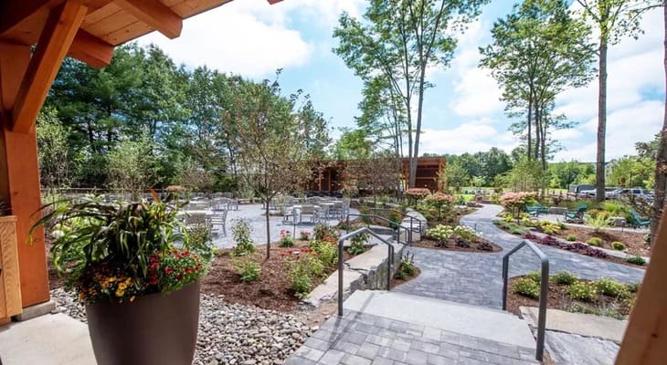 Druthers outdoor seating area and landscaped path view from inside