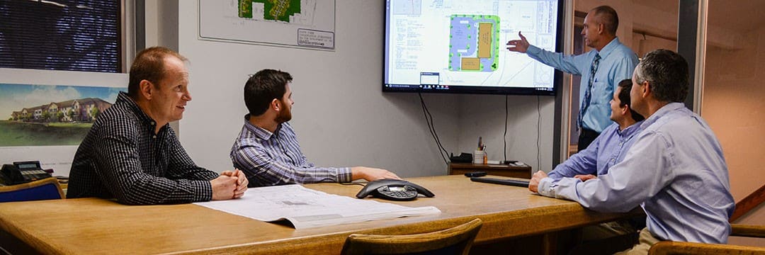 architects and engineers around a conference desk